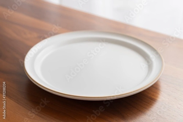 Fototapeta お皿と木のテーブル