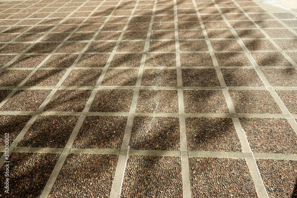 Obraz shade pattern on textured concrete patio squares