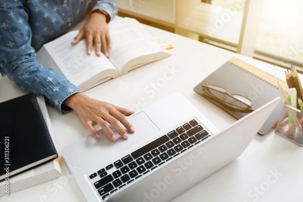 Fototapeta College student working with school assignment.