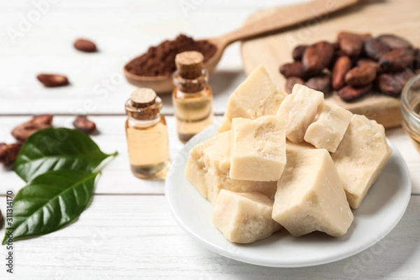 Obraz Organic cocoa butter on white wooden table