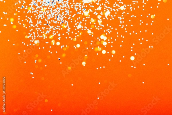 Obraz Orange festive background with blue sparkles. The concept of the celebration, the day of St. Valentine, New Year, birthdays, ceremonies, events, etc.
