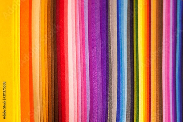 Fototapeta multicolored sheets of paper are spread out