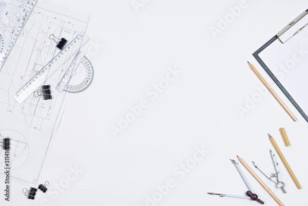 Fototapeta Architectural plans, pencil and ruler on the table. Place for your text