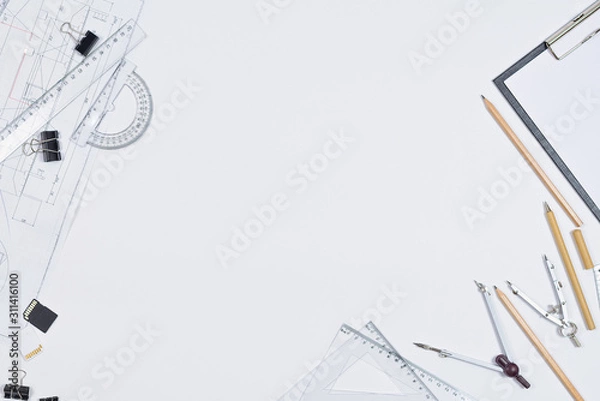 Fototapeta Architectural plans, pencil and ruler on the table. Place for your text