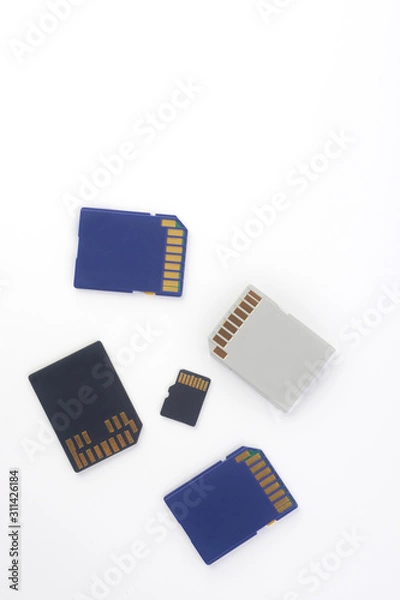 Fototapeta  memory cards in blue, white and black on a white background. Flat lay