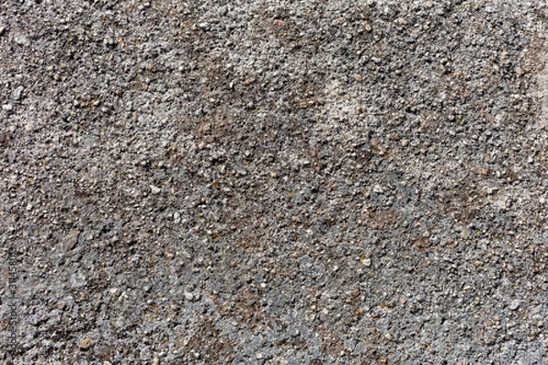 Fototapeta OLD SURFACE OF  ROUGH CEMENT WITH SMAL STONES, BACKGROUND