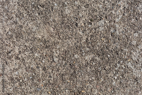 Fototapeta OLD SURFACE OF  ROUGH CEMENT WITH SMAL STONES, BACKGROUND