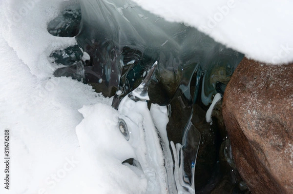 Fototapeta Frozen winter nature with snow and ice