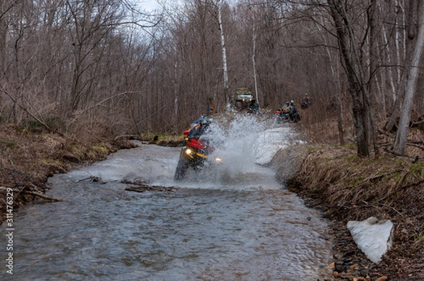 Fototapeta ATV travel in spring in Khabarovsk Territory