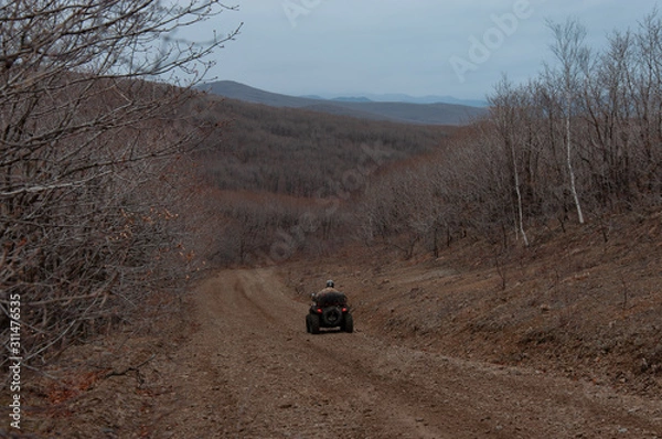 Fototapeta ATV travel in spring in Khabarovsk Territory
