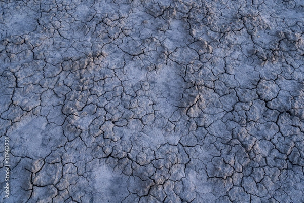 Fototapeta Moody blue cracked mud