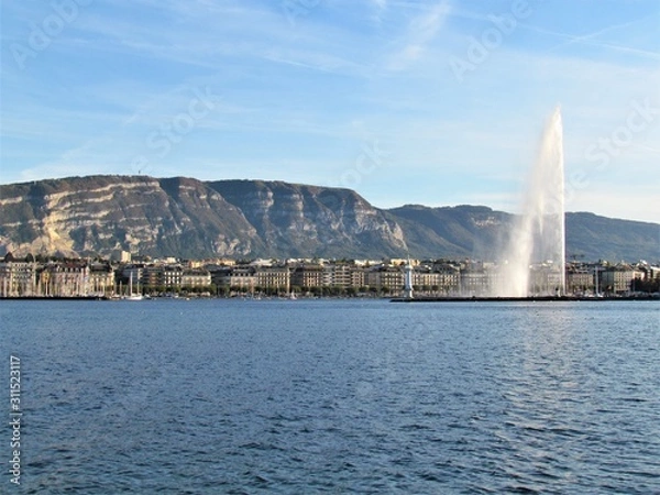 Fototapeta Geneva, Switzerland - October 18th 2019: a Beautiful autumn day in Lake Leman in Geneva. The Lake is surrounded by beautiful mountain that makes the sailing even more spectacular for the many sailors