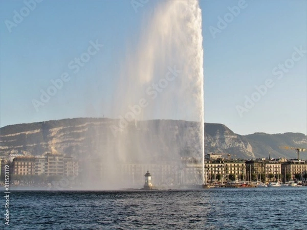 Fototapeta Geneva, Switzerland - October 18th 2019: a Beautiful autumn day in Lake Leman in Geneva. The Lake is surrounded by beautiful mountain that makes the sailing even more spectacular for the many sailors
