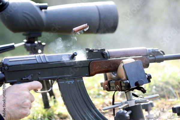 Obraz Ejecting cartridge case with smoke