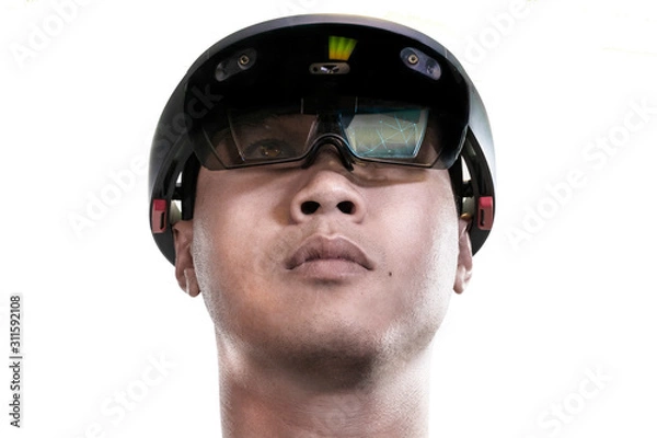 Fototapeta Low view portrait of asian man experiences Mixed reality with HoloLens 1 on white background. Future advanced technology concept