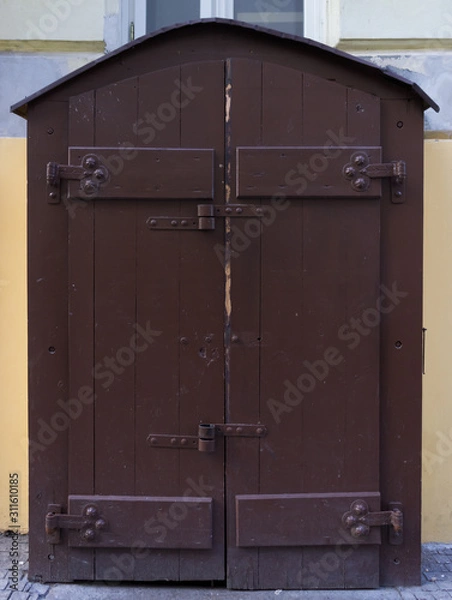 Fototapeta Wooden door with forged elements in high resolution