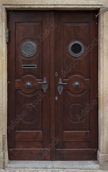 Fototapeta Wooden door with forged elements in high resolution