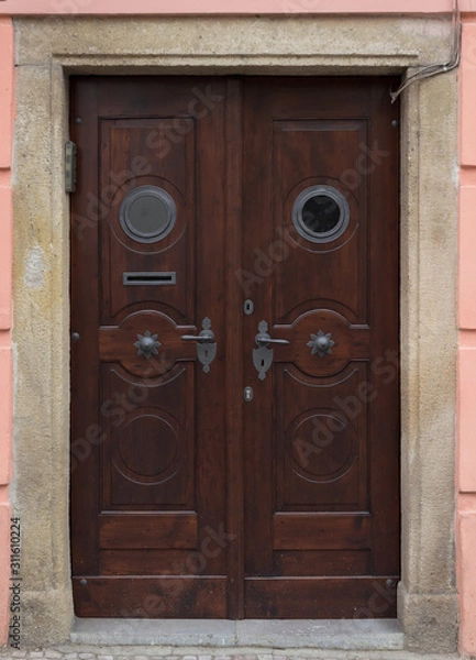 Fototapeta Wooden door with forged elements in high resolution