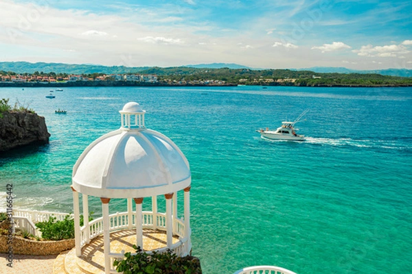 Obraz Beautiful white gazebo and tropical flower garden on Caribbean ocean background, summer mountain view , Sosua, Puerto Plata, Dominican Republic