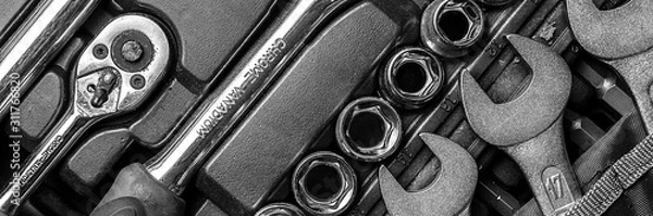 Fototapeta Black and white men tools background. Worker tools and  equipments close-up. Panoramic banner.