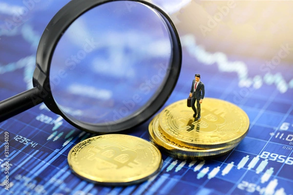 Fototapeta Miniature people : Businessman with Magnifying glass of bitcoin graph chart ,bitcoin Stock Market Analysis