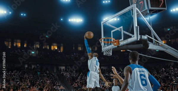 Obraz Basketball players on big professional arena during the game. Tense moment of the game. Celebration