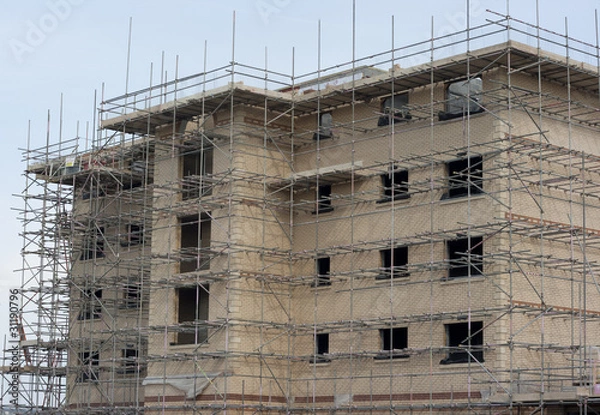 Obraz building constuction with scaffolding