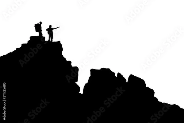 Fototapeta hikersSilhouette of two hikers standing on a rock and pointing to the distance. Two men in the mountains. Black and white silhouette of men with backpacks on a trekking trip in the mountains.