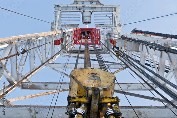 Fototapeta Looking up inside the derrick