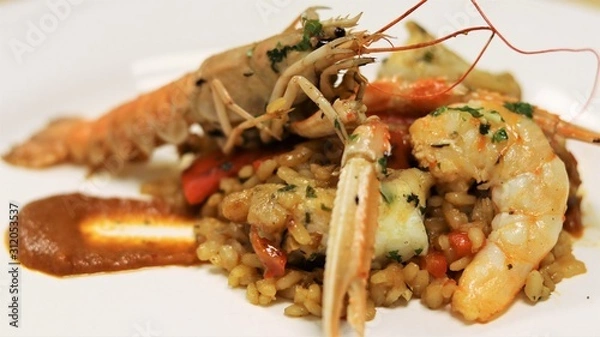 Fototapeta Vegetables and Fish used to cook Paella in the typical Spanish Way. This Spanish speciality can be made with seafood or meat
