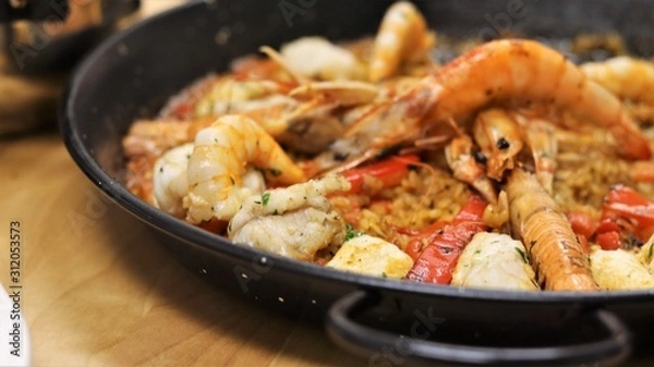 Fototapeta Vegetables and Fish used to cook Paella in the typical Spanish Way. This Spanish speciality can be made with seafood or meat