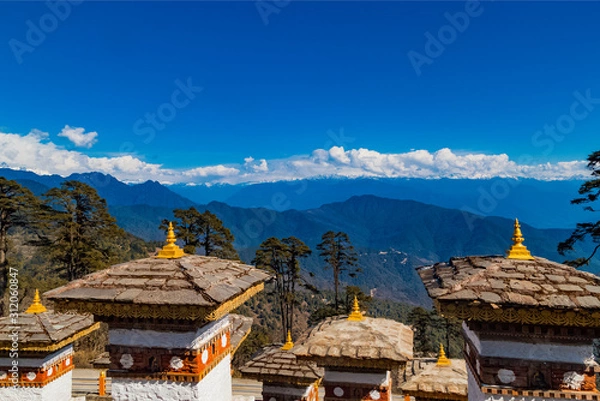 Fototapeta 108 Memorial Chortens of Dochula Pass- mountain pass in Himalayas within Bhutan on the road from Thimpu Thimphu to Punakha, Bhutan.