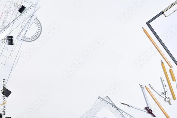 Fototapeta Architectural plans, pencil and ruler on the table. Working surface. Place for your text. View from above.