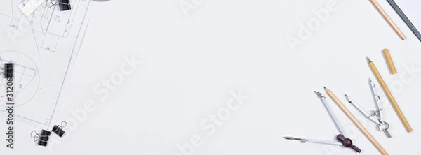 Fototapeta Architectural plans, pencil and ruler on the table. Working surface. Place for your text. View from above.