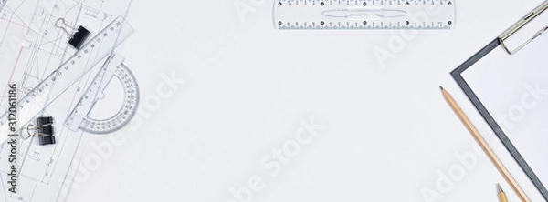 Fototapeta Architectural plans, pencil and ruler on the table. Working surface. Place for your text. View from above.