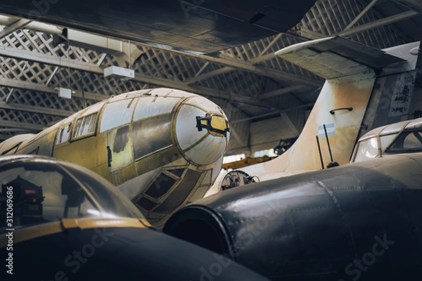 Obraz Vintage planes stored in old hangar
