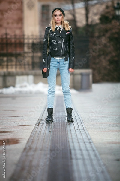 Obraz urban style girl standing alone on an empty street of novi sad