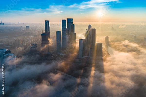 Obraz A aerial view of towers of the Moscow International Business Centre also known as Moscow City at dawn.