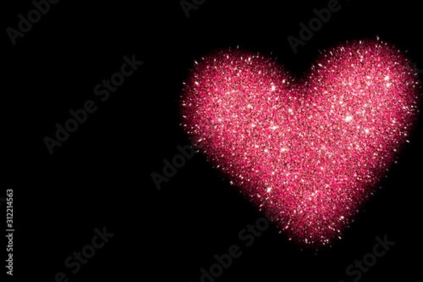 Obraz abstract background with pink heart isolated on black, shiny heart with glitter effect