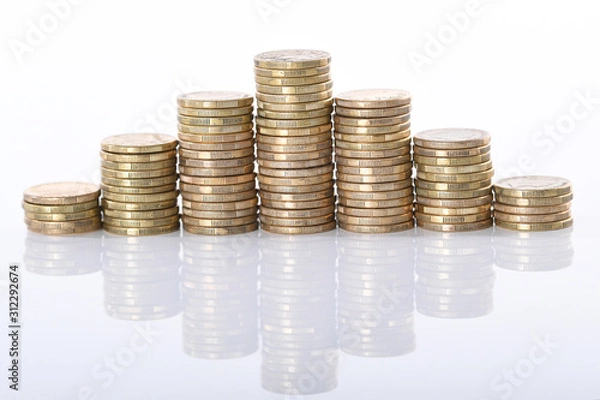 Obraz A stack of Australian one dollar gold coins set against a white background.