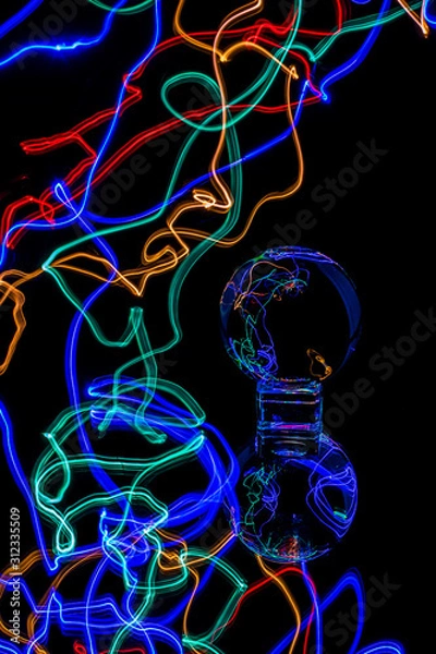 Fototapeta colorful light trails and with glass ball