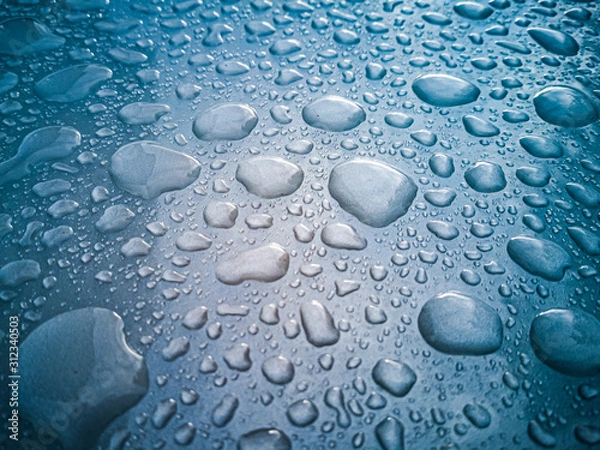 Obraz blue water drops on white surface