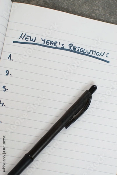 Obraz pen and notebook with a list of new years resolutions