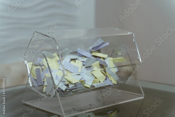 Fototapeta  Lottery drum with multi-colored tickets inside