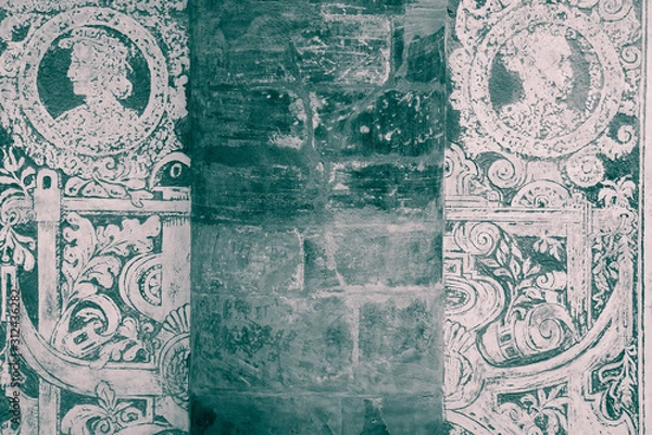Fototapeta Grunge sgraffito renaissance wall background  - Detail of the facade of Ball Game Hall (built in 1569) in Royal Garden of Prague Castle, Czech Republic - black and white photograph with dark teal tint