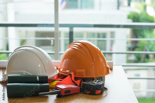 Fototapeta Architect desk ,Business,engineering concept, architecture concept. two helmet on the table, soft focus