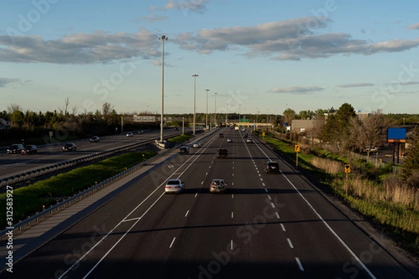 Obraz Highway top view from pedestrian pathway, golden light creating deep shadows. Ottawa, Ontario, Canada