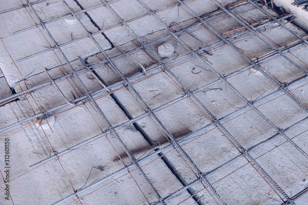 Fototapeta Deformed steel bars. Steel structure construction, structure of concrete for building bridge, Beautiful structure steel construction. ..A deformed steel bars frame inside concrete footing or floor