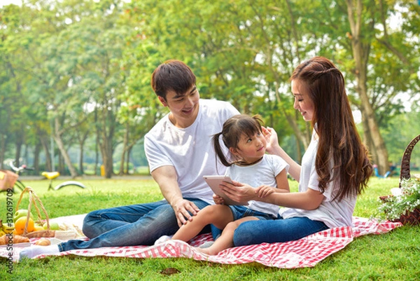 Obraz portrait of happy Asian family with picnic meal in relaxing day in garden, Asian family concept