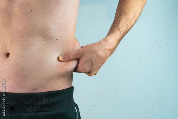 Obraz thin man with abdominal fat isolated on White background